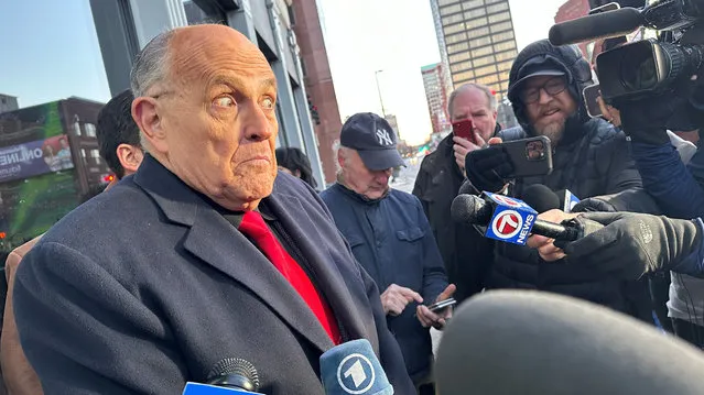 Rudy Giuliani speaks with reporters outside a bar where Ron DeSantis was scheduled to speak before announcing his election withdrawal, in Manchester, New Hampshire, U.S., January 21, 2024. (Photo by Nathan Frandino/Reuters)