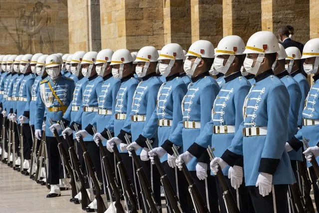Honor guards wear face masks as they are lined up according to the social distancing rules due to the coronavirus (COVID-19) pandemic during a celebration marking the 99th Anniversary of Turkeyâs Victory Day at Anitkabir, mausoleum of Turkish Republic founder Mustafa Kemal Ataturk in Ankara, Turkey on August 30, 2021. (Photo by Aytac Unal/Anadolu Agency via Getty Images)