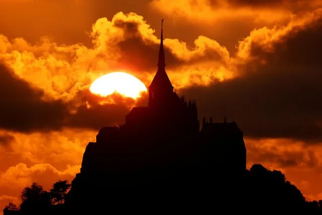 The iconic Mont Saint-Michel is seen at sunset in the western region of Normandy, France, August 22, 2021. (Photo by Pascal Rossignol/Reuters)