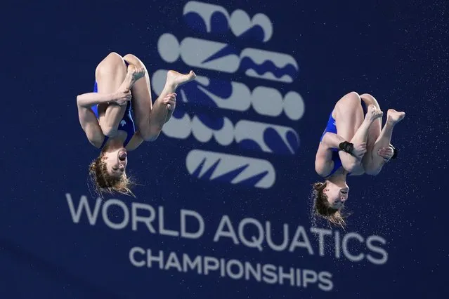 Caeli Mckay and Kate Miller of Canada compete during the women's synchronized 10m platform diving final at the World Aquatics Championships in Doha, Qatar, Tuesday, February 6, 2024. (Photo by Hassan Ammar/AP Photo)