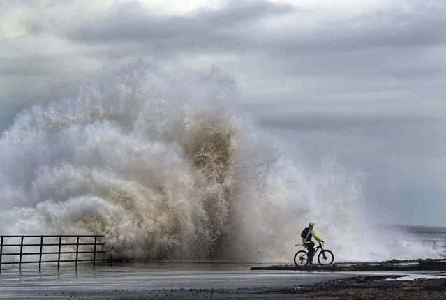 Huge waves crash against the sea wall near Whitley Bay, UK on Sunday, February 11, 2024. (Photo by Owen Humphreys/PA Images via Getty Images)