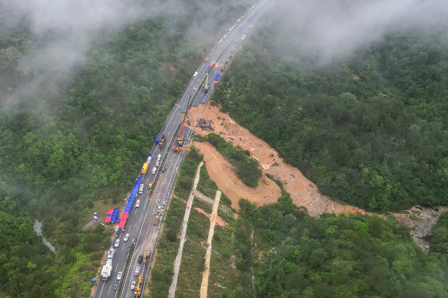 This photo taken on May 1, 2024 shows an aerial view of a collapsed section of a highway near Meizhou, in southern China’s Guangdong province. At least 36 people died after part of a highway collapsed due to heavy rain on May 1, state media said. (Photo by CNS//AFP Photo)