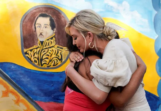 With an image of “El Liberator” Simon Bolivar on a mural behind, White House adviser Ivanka Trump hugs a migrant woman during a visit a center for Venezuelan migrants in Cucuta, Colombia, September 4, 2019. (Photo by Kevin Lamarque/Reuters)