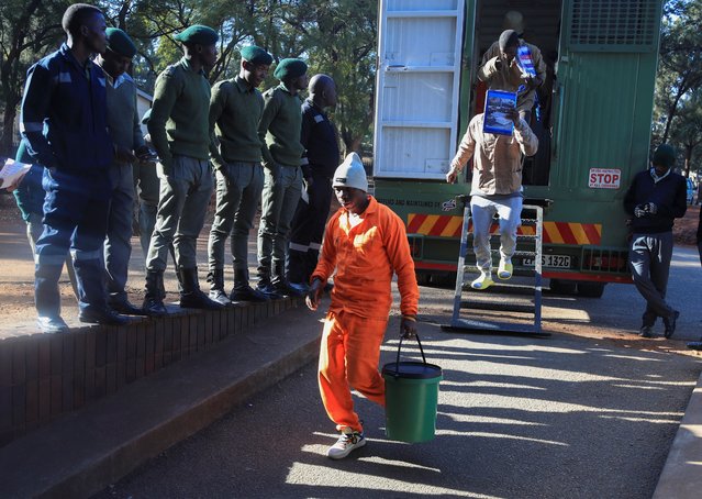 Some of the supporters of the opposition party Citizens Coalition for Change (CCC), arrested for holding a political gathering that authorities said was unauthorized, disembark a prison truck as they arrive for bail application at the Harare Magistrates' Court, in Harare, Zimbabwe on June 21, 2024. (Photo by Philmon Bulawayo/Reuters)
