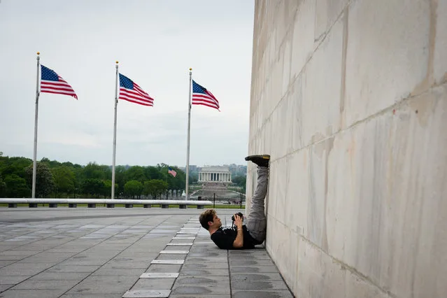 During a press preview tour Saturday, May 10, 2014, Jeff Petriello, of Mashable, takes a photograph of The Washington Monument.  The Washington Monument reopens on Monday after being repaired by engineers after the earthquake in 2011. (Photo by Sarah L. Voisin/The Washington Post)