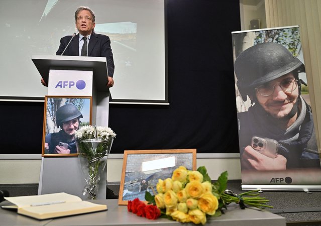 Chairman and Chief executive officer of Agence France-Presse, Fabrice Fries, speaks next to a portrait of AFP journalist Arman Soldin, who was killed in the Donbas region while covering the conflict in Ukraine, during commemoration ceremony in Kyiv, on May 15, 2023. Soldin, AFP's video coordinator in Ukraine, died on May 9, 2023, when an AFP team came under fire from Grad rockets while they were with a group of Ukrainian soldiers near Bakhmut, the epicentre of the fighting for months. (Photo by Sergei Supinsky/AFP Photo)