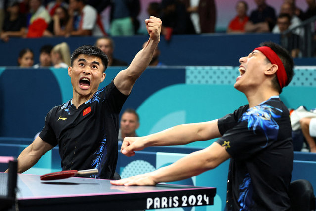 Ningning Cao and Panfeng Feng of China react during their match against Wanchai Chaiwut and Yuttajak Glinbancheun of Thailand during men's table tennis doubles MD8 semifinals in Paris, France on August 30, 2024. (Photo by Kacper Pempel/Reuters)