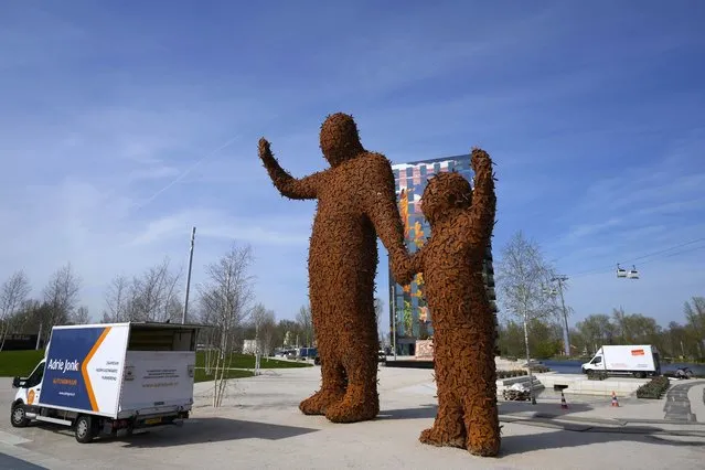 Two giant statues made out of metal bees greet visitors to the once-a-decade Dutch horticultural exhibition called Floriade, in Almere, Netherlands, Monday, April 11, 2022, that aims to showcase ways of making urban areas more sustainable as global populations increasingly shift to cities. (Photo by Peter Dejong/AP Photo)