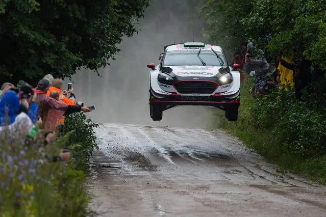 British Elfyn Evans and his co- driver Daniel Barritt steer their Ford Fiesta WRC during the special stage of the Orlen Rally Poland in Chmielewo, on June 30, 2017. (Photo by Wojtek Radwanski/AFP Photo)