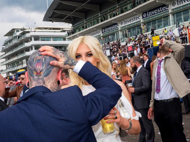 Jethro and Kitty from Stratford on Ladies' Day at Epsom, England on June 2, 2017. Ladies' Day is traditionally held on the first Friday of June, a multitude of ladies and gents head to Epsom Downs Racecourse to experience a day full of high octane racing, music, glamour and fashion. (Photo by Peter Dench/Getty Images Reportage)