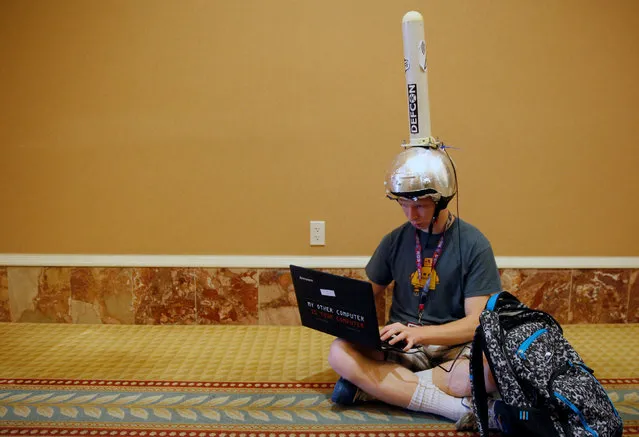 Michael Berna uses a functional antenna attached to his helmet to monitor wi-fi networks during the Def Con hacker convention in Las Vegas, Nevada, U.S. on July 29, 2017. (Photo by Steve Marcus/Reuters)