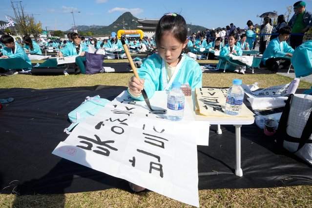 South Korean girl Yang Hae-yoon takes part in a Korean calligraphy contest as part of events to celebrate the 578th anniversary of the creation of the Korean alphabet, Hangeul, in Seoul, South Korea, Wednesday, October 9, 2024. (Phoot by Ahn Young-joon/AP Photo)