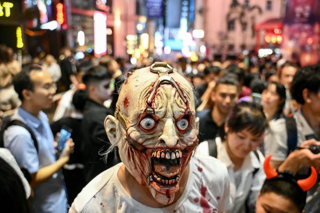 A reveller takes part in Halloween celebrations in the Lan Kwai Fong area of Hong Kong on October 31, 2024. (Photo by Peter Parks/AFP Photo)
