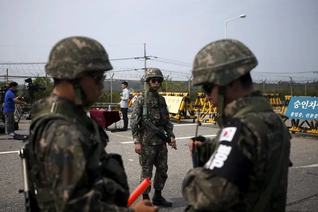 South Korean soldiers stand guard at a checkpoint on the Grand Unification Bridge which leads to the truce village Panmunjom, just south of the demilitarized zone separating the two Koreas, in Paju, South Korea, August 24, 2015. (Photo by Kim Hong-Ji/Reuters)