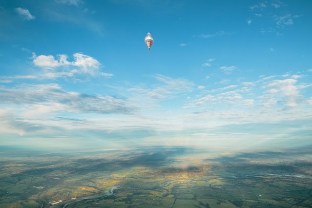 A handout picture provided by the press service of MORTON Group of Companies, show the balloon of Russian adventurer Fedor Konyukhov in the sky during his solo round-the-world balloon flight just after taking off from a spot near Northam, 96 kilometres north-east of Perth in Western Australia, 12 July 2016. Fedor Konyukhov took off from Northam on 12 July 2016 in attempt to beat the record of 13 days of American aviator Steve Fossett. (Photo by EPA/Morton Press Service)