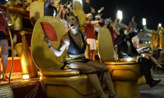Performers from the Uniao da Ilha samba school parade on a float during Carnival celebrations at the Sambadrome in Rio de Janeiro, Brazil, Monday, February 24, 2020. (Photo by Leo Correa/AP Photo)