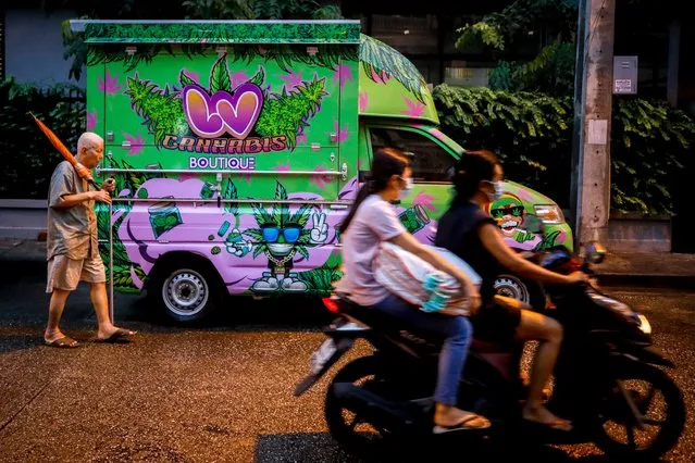 A man walks past a mobile cannabis boutique in Bangkok, Thailand, 12 September 2022. A bill on cannabis and hemp was set to be proposed to the House on 12 September, and if approved, it would potentially allow hospitals to grow cannabis for medication, and households to grow up to 15 cannabis plants intended for domestic use, and/or farm cannabis with the intention to use the roots and fibre of the plant. (Photo by Diego Azubel/EPA/EFE)