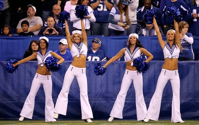 Indianapolis Colts cheerleaders participate in the NFL's Salute to Service campaign to honor the armed forces by wearing military-styled uniforms during the Colts' game against the Dolphins. (Photo by Allen Eyestone/The Palm Beach Post)