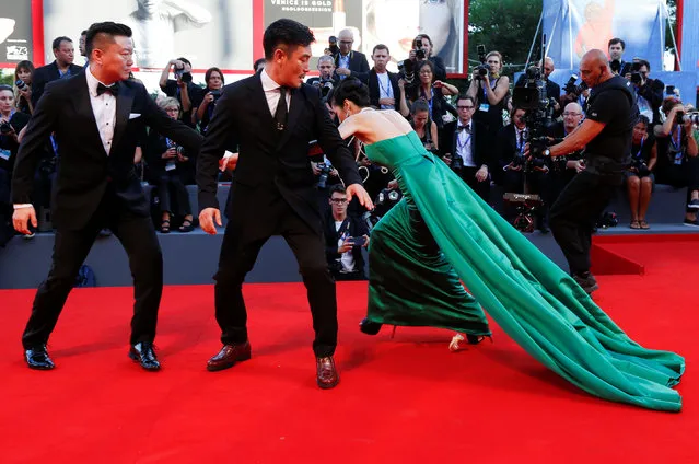A guest falls during the red carpet event for the movie “The Light Between Oceans” at the 73rd Venice Film Festival in Venice, Italy September 1, 2016. (Photo by Alessandro Bianchi/Reuters)