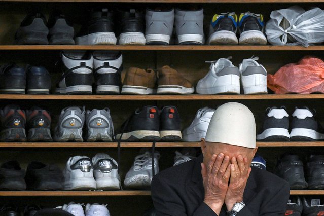 A muslim devote offers prayers for Eid al-Fitr which marks the end of the holy fasting month of Ramadan, at the Grand Mosque of Pristina on March 30, 2025. (Photo by Armend Nimani/AFP Photo)