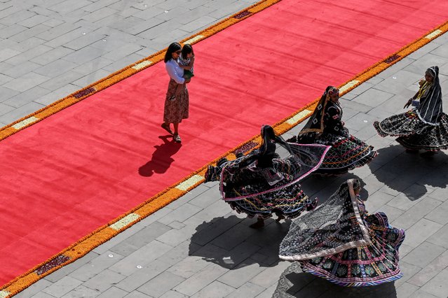 Second Lady Usha Vance, wife of U.S. Vice President JD Vance, and their daughter Mirabel watch a cultural performance at Amber Fort, a historical site in Jaipur, India on April 22, 2025. (Photo by Kenny Holston/Reuters)
