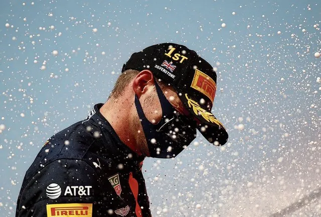 Dutch Formula One driver Max Verstappen of Aston Martin Red Bull Racing celebrates on the podium after winning the 70th Anniversary Formula One Grand Prix of Great Britain at the Silverstone Circuit, in Northamptonshire, Britain, 9 August 2020. (Photo by Bryn Lennon/EPA/EFE)