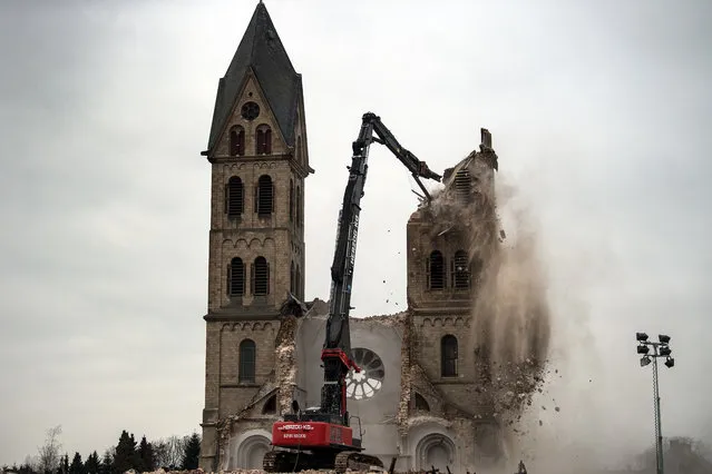 The desacralized St Lambertus church in Erkelenz-Immerath, western Germany, is being demolished on January 9, 2018, in order to make possible brown coal surface mining. Residents from the village of Immerath were relocated previously, as the area is to be exploited by German energy supplier RWE Power in an extension of their Tagebau Garzweiler open pit lignite mine. (Photo by Federico Gambarini/AFP Photo/DPA)