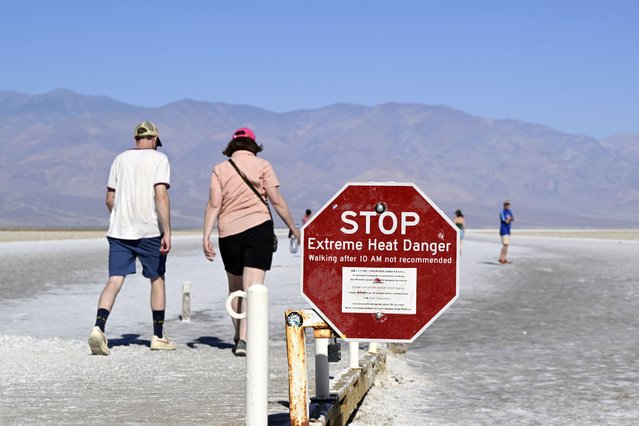 Tourists visit Badwater Basin as “Extreme Heat Warning” issued in Death Valley National Park of California, United States on May 29, 2025. Badwater Basin is the lowest point in North America, with an elevation of 282 feet (86 meters) below sea level. The basin is a salt-flat depression surrounded by mountains, and its name comes from the saltwater springs and pools that exist within the area. (Photo by Tayfun Coskun/Anadolu via Getty Images)
