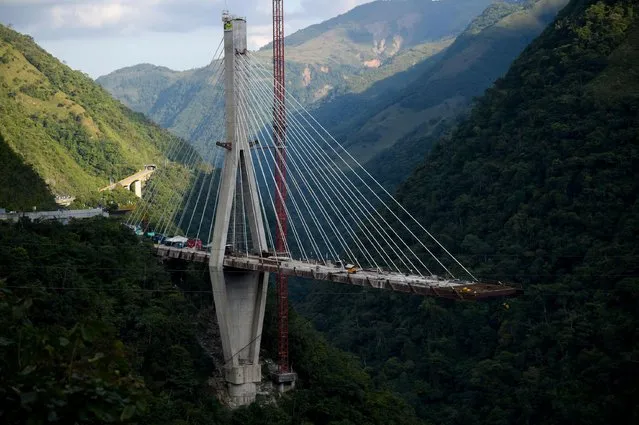 General view of a bridge that collapsed in Guayabetal municipality on the road that connects Bogota with the city of Villavicencio, Cundinamarca department, on January 15, 2018. When the structure suddenly collapsed, there were about 35 or 40 workers at the site. Ten workers were killed and eight injured, according to the authorities. (Photo by Raul Arboleda/AFP Photo)