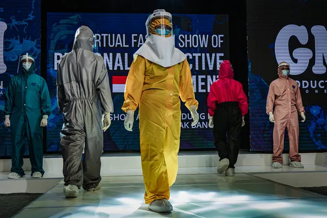Medical workers showcase designs during the virtual fashion show of personal protective equipment (PPE) amid the Coronavirus pandemic on August 1, 2020 in Yogyakarta, Indonesia. The fashion show was held as a form of gratitude for all medical personnel who had fought against covid-19. Indonesia is struggling to contain hundreds of new daily cases of coronavirus amid easing of rules to allow economic activity to resume, over 100,000 coronavirus cases have been recorded and more than 5,100 fatalities. (Photo by Ulet Ifansasti/Getty Images)