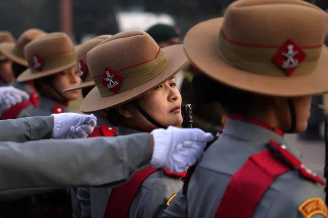 Women soldiers of Assam Rifles, an Indian paramilitary force, practice march-past for the upcoming Republic day parade, in New Delhi, India, Thursday, January 19, 2023. India's Republic day will be celebrated on Jan. 26. (Photo by Manish Swarup/AP Photo)