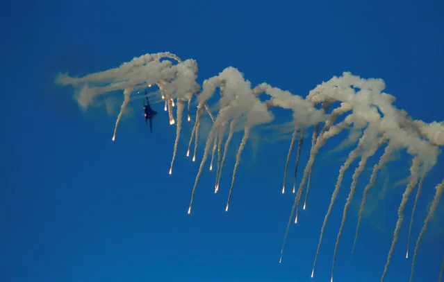 A Ukraine Air Force Su-27 Flanker fighter aircraft releases flares while taking part in the Malta International Airshow off SmartCity Malta, outside Valletta, Malta, September 24, 2016. (Photo by Darrin Zammit Lupi/Reuters)