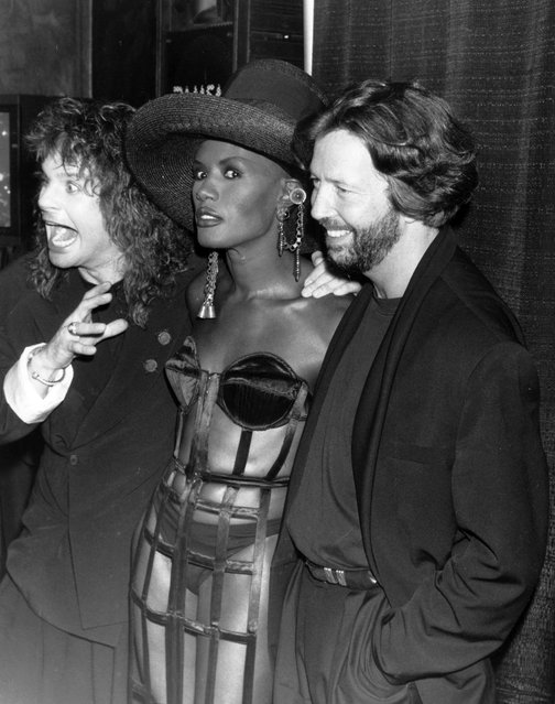 English singer Ozzy Osbourne, model Grace Jones and English guitarist Eric Clapton posing together at the International Rock Awards, London on June 2nd 1989. (Photo by Dave Hogan/Getty Images)