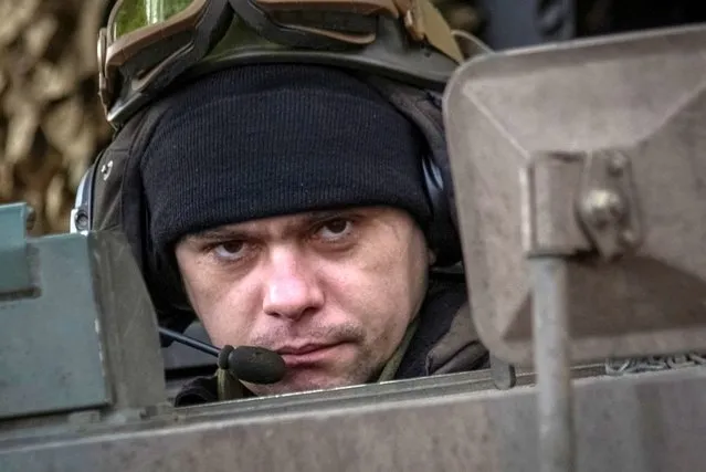 A Ukrainian serviceman prepares a Polish self-propelled howitzer Krab to fire toward Russian positions, amid Russia's attack on Ukraine, on a frontline in Donetsk region, Ukraine on January 17, 2023. (Photo by Oleksandr Ratushniak/Reuters)