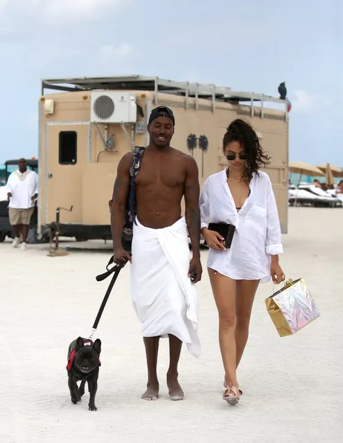 Newly Weds Shanina Shaik and and husband DJ Ruckus on Miami Beach just a few days after getting married in the Bahamas a with their adorable dog on May 1,2018. (Photo by OHpix/Splash News and Pictures)