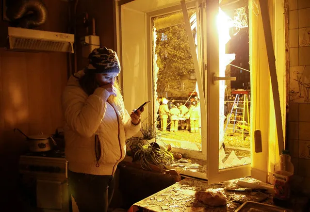 A local woman reacts inside of her damaged house after it was hit in a shelling, in the pro-Russian rebels controlled Makeyevka city, near Donetsk, Ukraine, late 27 October 2016. According to reports quoting Ukraine's Foreign Minister Pavlo Klimkin, Klimkin said that the occupied parts of the Donetsk and Luhansk regions have no actual representatives, because these areas are controlled from the Russian Rostov and Moscow. (Photo by Alexander Ermochenko/EPA)