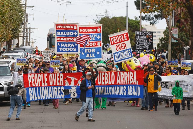 People march during a People Over Billionaires protest in the Pacific Heights neighborhood of San Francisco, Saturday, November 15, 2025. (Photo by Stephen Lam/San Francisco Chronicle via AP Photo)