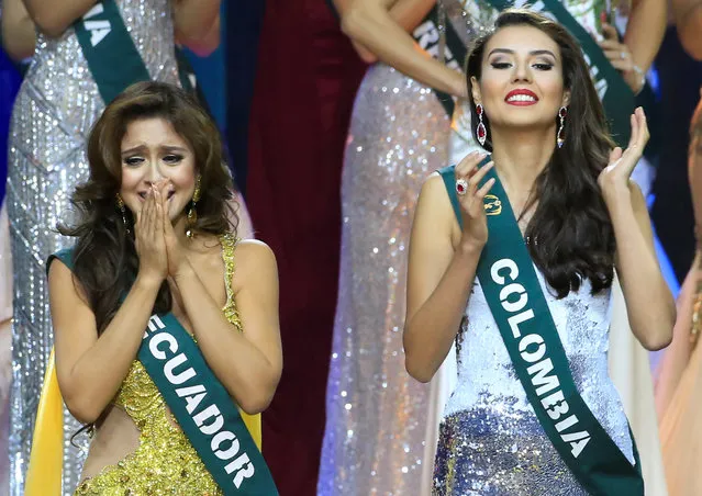 Miss Ecuador Katherine Espin (L), crowned this year's Miss Earth, reacts while Miss Colombia Michelle Gomez, who won as Miss Earth Air gestures during the Miss Earth 2016 International coronation night at a mall in Pasay city, metro Manila, Philippines, October 29, 2016. (Photo by Romeo Ranoco/Reuters)