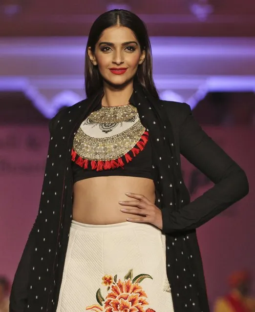 In this Saturday, January 17, 2015 photo, Bollywood actor Sonam Kapoor displays a creation by designer Rohit Bal during a fashion show to promote “Khadi”, or hand-spun fabric in Ahmadabad, India. (Photo by Ajit Solanki/AP Photo)