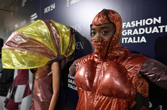 Models wear creations obtained by old paragliding sails who have become a collection of 25 transformable and sustainable outfits for the IAAD Fashion Show part of the 10th edition of Fashion Graduate Italia, Milan, Italy, 24 October 2024. IAAD Fashion Show is an event organized by Piattaforma Sistema Formativo Moda, where young talents from the best fashion schools and academies will showcase their innovative projects and content in both physical and digital displays. (Photo by Daniel Dal Zennaro/EPA/EFE)