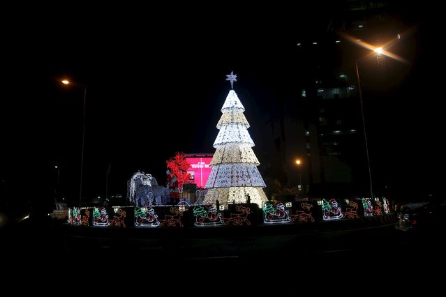 A Christmas tree is seen at a roundabout in Victoria Island district in Lagos, Nigeria, December 9, 2015. (Photo by Akintunde Akinleye/Reuters)