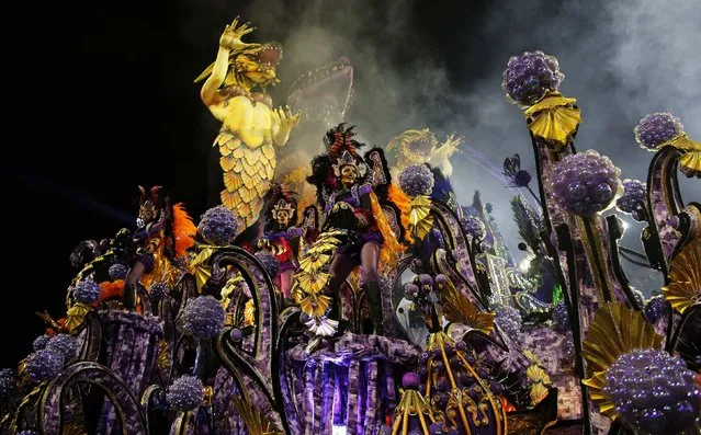 Revellers from the Rosas de Ouro Samba School take part in a carnival at Anhembi Sambadrome in Sao Paulo February 14, 2015. (Photo by Nacho Doce/Reuters)