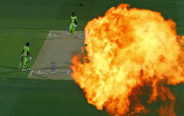 Pakistan's batsman Shahid Afridi (L) and Misbah Ul Haq are pictured alongside a flame thrower signaling a Afridi's dismissal during their Cricket World Cup loss to India in Adelaide, February 15, 2015. (Photo by David Gray/Reuters)