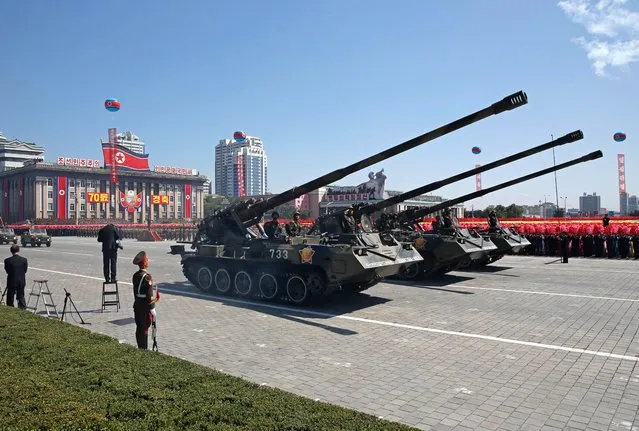 Tanks roll past during a parade for the 70th anniversary of North Korea's founding day in Pyongyang, North Korea, Sunday, September 9, 2018. North Korea staged a major military parade, huge rallies and will revive its iconic mass games on Sunday to mark its 70th anniversary as a nation. (Photo by Kin Cheung/AP Photo)