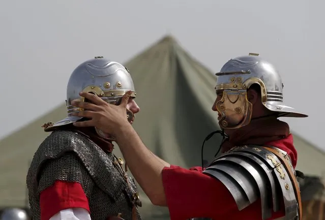 Members of the Legio X Fretensis (Malta) re-enactment group prepare for a re-enactment of ancient Roman army life at Fort Rinella in Kalkara, outside Valletta, March 22, 2015. (Photo by Darrin Zammit Lupi/Reuters)