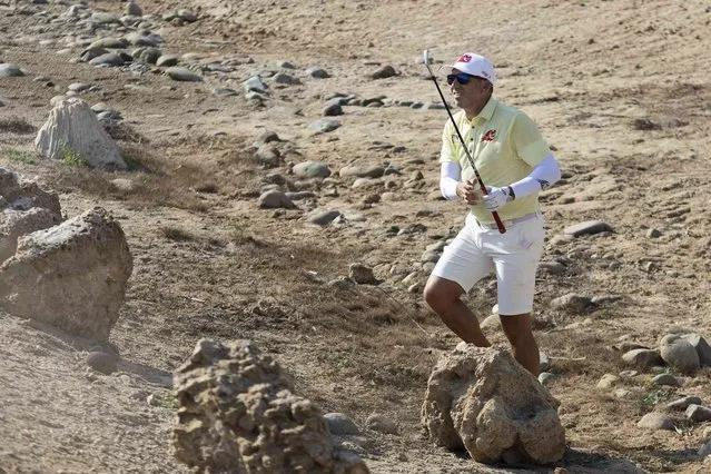 Captain Sergio Garcia of Fireballs GC hits out of the rough on the 18th hole during the first round of LIV Golf Jeddah at the Royal Greens Golf & Country Club on Friday, October 13, 2023 in King Abdullah Economic City, Saudi Arabia. (Photo by Jon Ferrey/LIV Golf via AP Photo)
