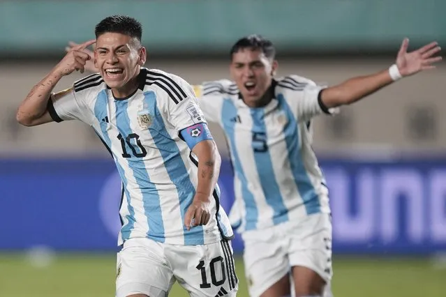 Argentina's Claudio Echeveri, left, celebrates during their FIFA U-17 World Cup Group D soccer match against Japan at Si Jalak Harupat Stadium in Bandung, West Java, Indonesia, Tuesday, November 14, 2023. (Photo by Achmad Ibrahim/AP Photo)