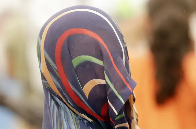 A victim of sexual violence participates in a Dignity March in Mumbai, India, Thursday, December 20, 2018. The march was held to call for a change in attitude towards victims of sexual violence. (Photo by Rajanish Kakade/AP Photo)