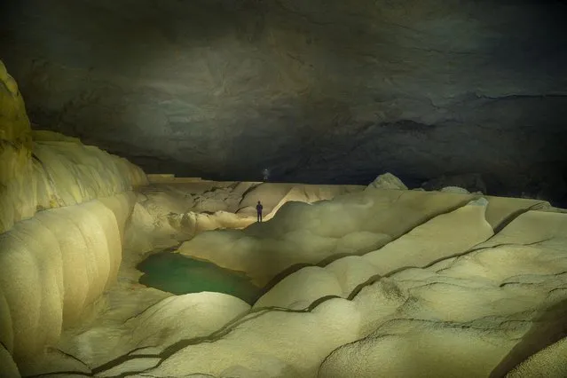 The Giant Gour in the Oxbow area of the cave is 60 meters long and is probably one of the world?s largest rimstone basins. The pool is filled with water during the wet season. The rims of basins like this grow taller each year as calcite precipitates from cave water as it flows faster over protrusions on March 2015 at Tham Khoun Ex, Laos. (Photo by John Spies/Barcroft Media/ABACAPress)