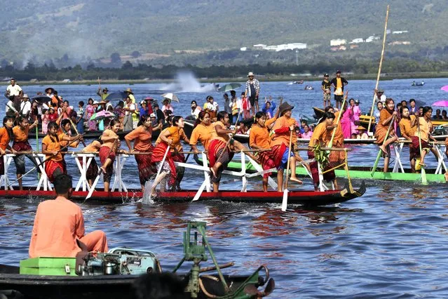Inntha ethnic people row their boats during traditional boats racing competition to mark the pagoda festival Thursday, October 19, 2023, in Inlay Lake, southern Shan State, Myanmar. (Photo by Thein Zaw/AP Photo)